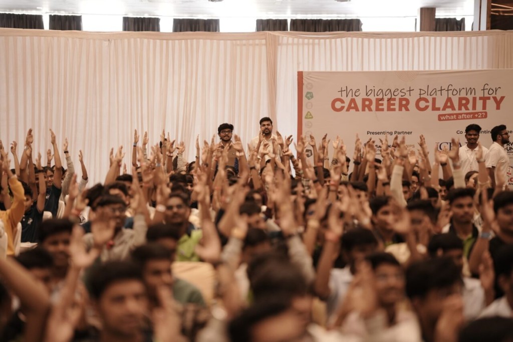 Students raising hands at Career Uttsav for career clarity