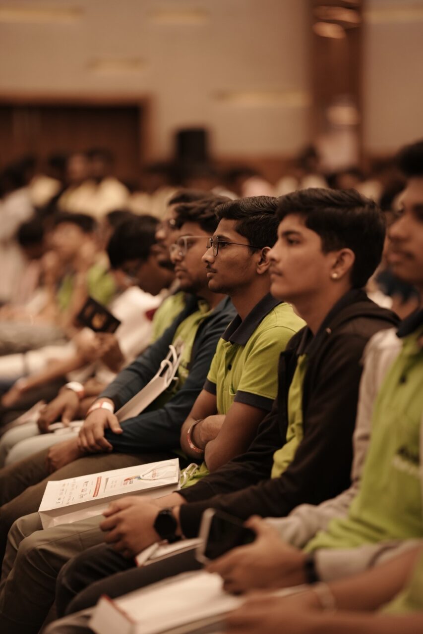 Students at Career Uttsav listening and taking notes